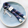 Idea con portachiavi Mix & Match con pelle DQ e cordoncino tubolare intrecciato